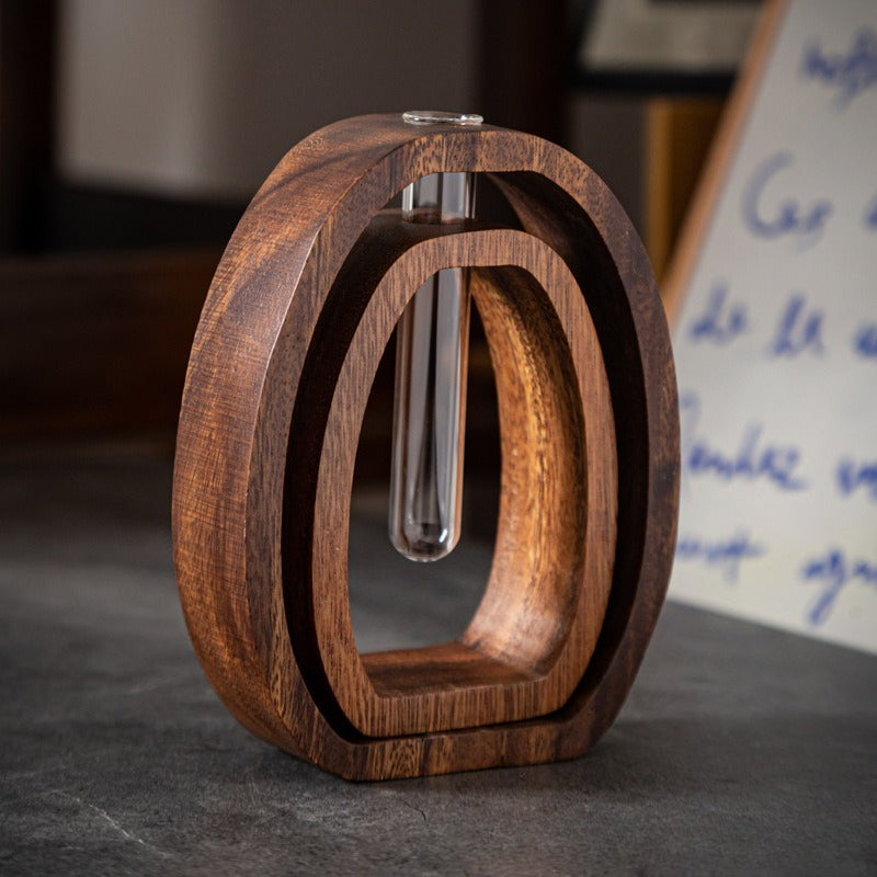 This Set of Four Hydroponic Plant Holders Made from Walnut Wood Features Two Round Geometric Bases And Two Glass Vases, Along with a Stylish Glass Flower Vessel for Desktop Use, Enhancing The Decor of Both Home And Office Environments